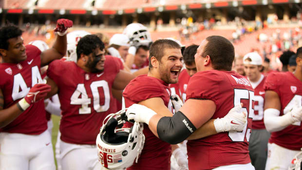 Oct 22, 2022; Stanford, California, USA; Stanford Cardinal edge rusher Lance Keneley (left) and center Drake Metcalf (55) celebrate following their 15-14 victory over the Arizona State Sun Devils at Stanford Stadium. Mandatory Credit: D. Ross Cameron-USA TODAY Sports